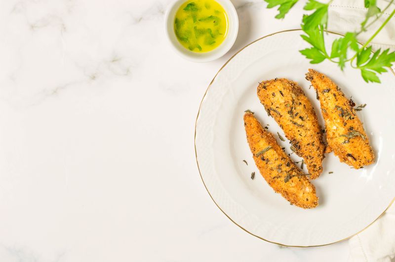 Parmesan crusted chicken tenders with herb coating